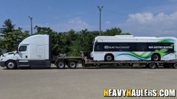 Bus shipped on a step deck trailer.