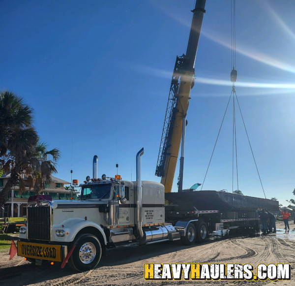 Wilson conveyor trailer shipped on an RGN.