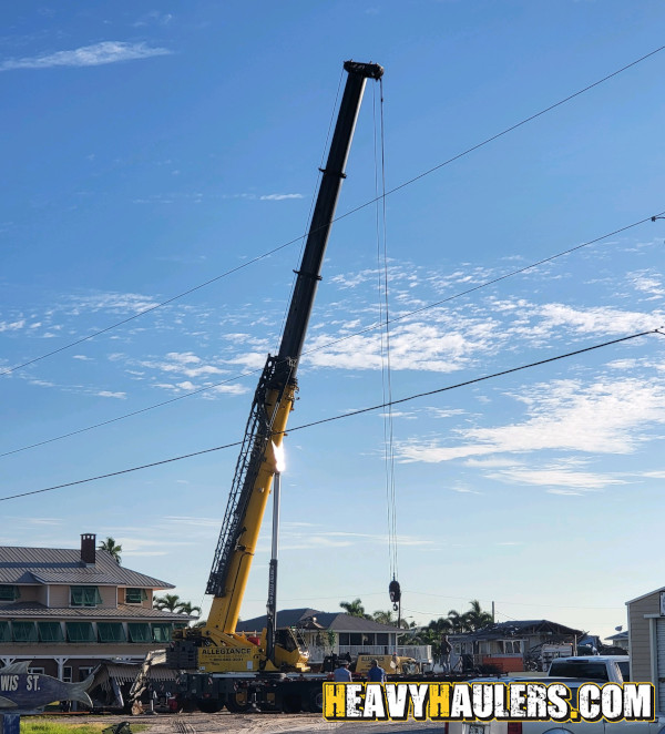 Oversize Wilson Conveyor on an RGN trailer.