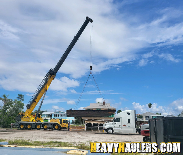 Wilson conveyor trailer shipped on an RGN.