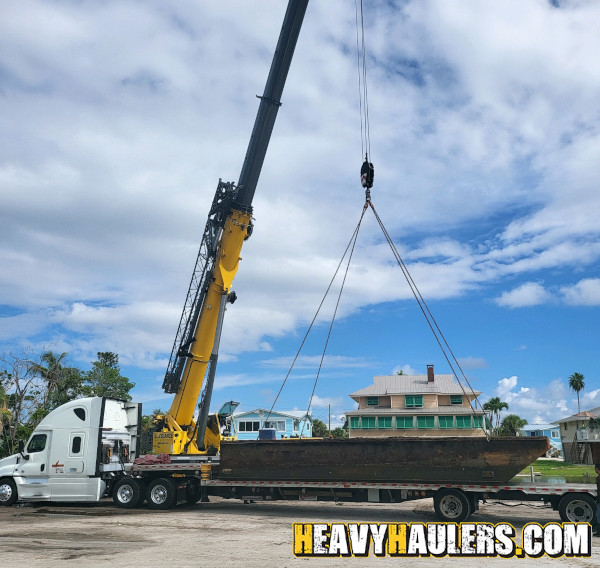 Wilson conveyor trailer shipped on an RGN.