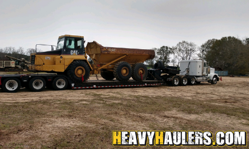 oversize rock truck transport on trailer