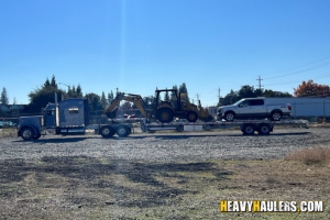 Backhoe shipped on a step deck trailer.