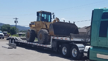 Shipping a wheel loader on a drop deck trailer.