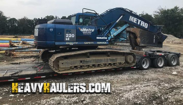 Excavator shipped on an RGN trailer.