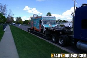 Transportation of a food truck on an RGN trailer.