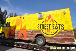 Loading a 2022 food truck on a trailer.