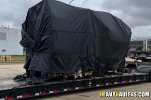 Cnc machines shipped on an rgn step deck trailer.