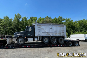 2007 Frieghtliner 235B dump truck shipped on an rgn step deck trailer.