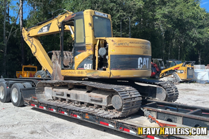 Loading a Cat 314 excavator an RGN trailer.