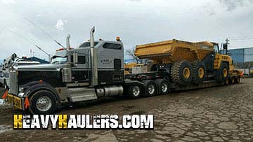 Transporting a Komatsu articulated dump truck.