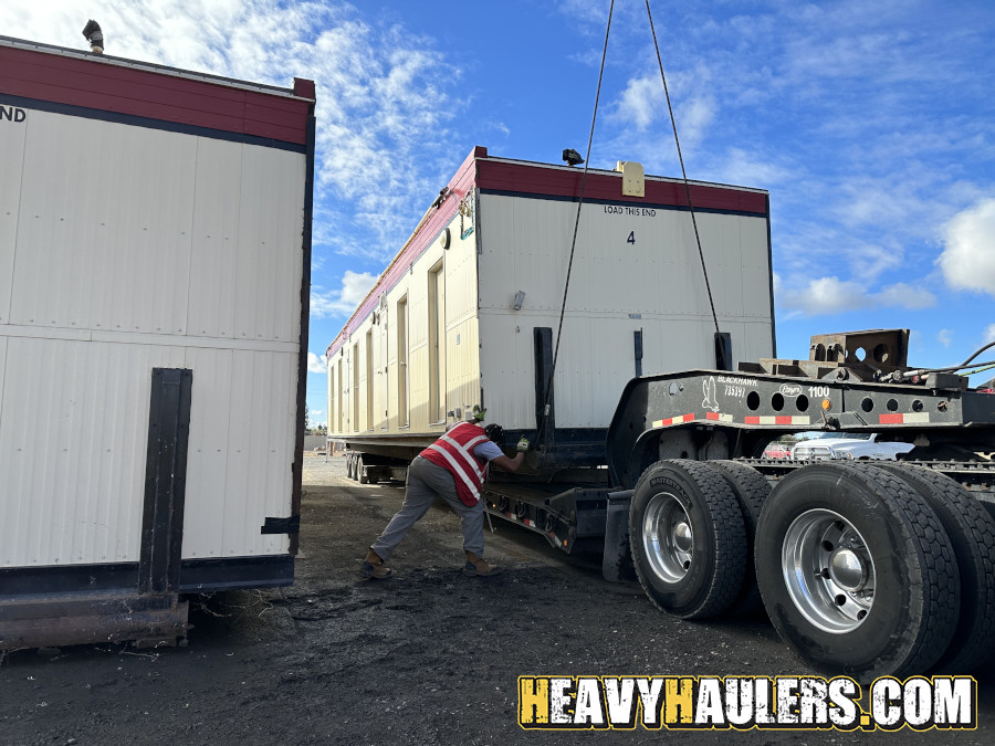 Wilson conveyor trailer shipped on an RGN.