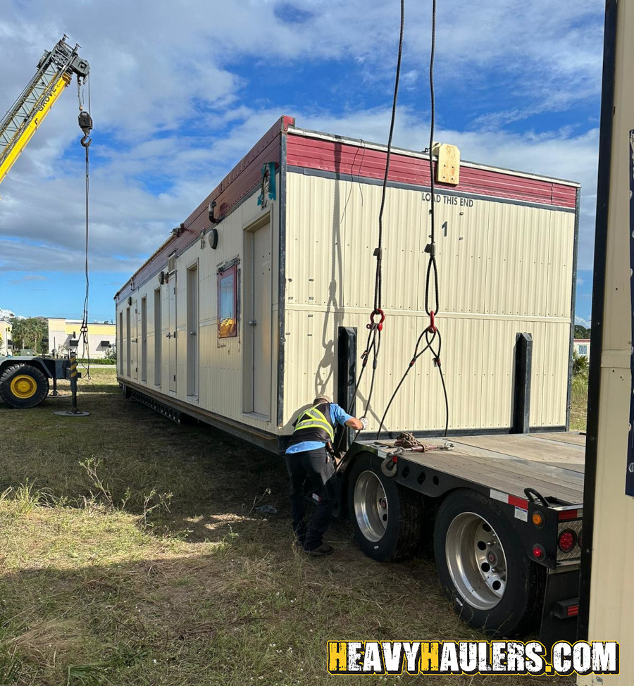 Wilson conveyor trailer shipped on an RGN.