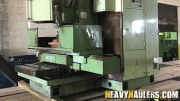 Hauling 1985 okuma MC4VA lathe machine.