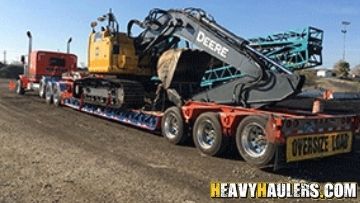 Removable Goose Neck (RGN) Trailer Shipping an Excavator