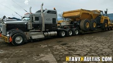 Removable Goose Neck (RGN) Trailer Shipping a Dump Truck