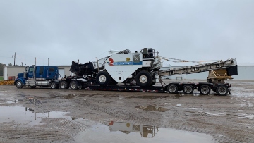 Loading a Roadtec cold planer on an RGN trailer.