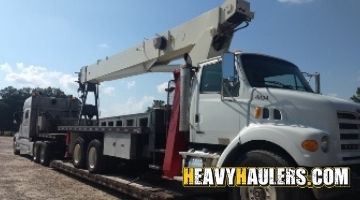 Loading a Sterling Terex crane on a trailer.