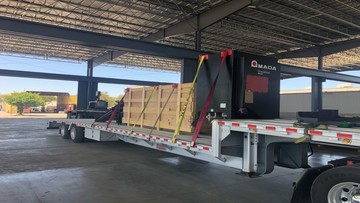 A turret press being hauled by Heavy Haulers