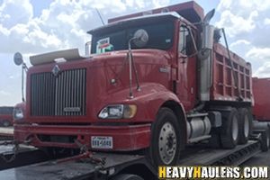 Transporting an International dump truck.