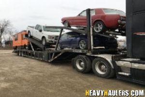 Loading a workhorse food truck on a trailer.